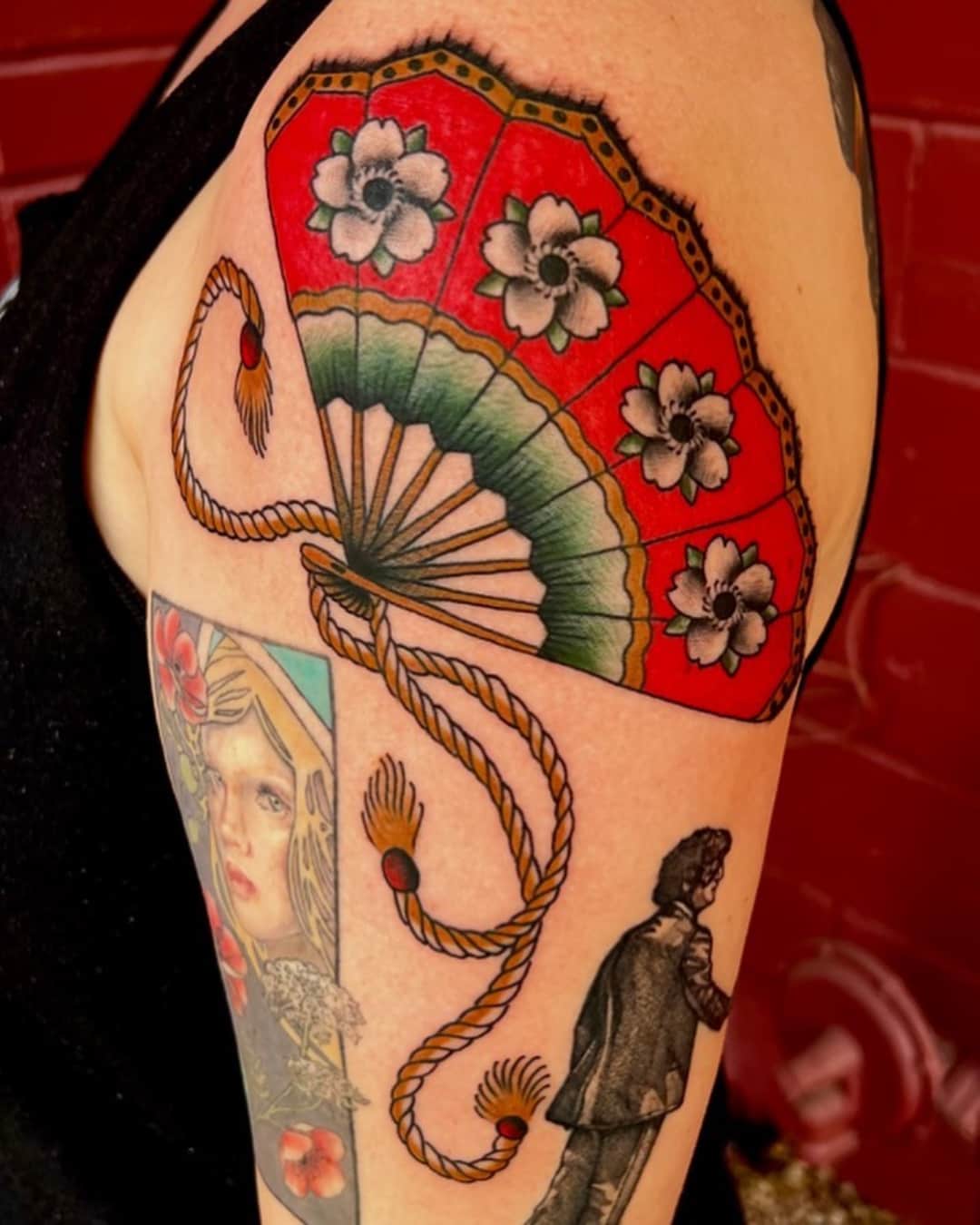Flower, fan and portrait tattoo on the shoulder, patchwork, American Traditional style, by Donny Newman in Austin, TX