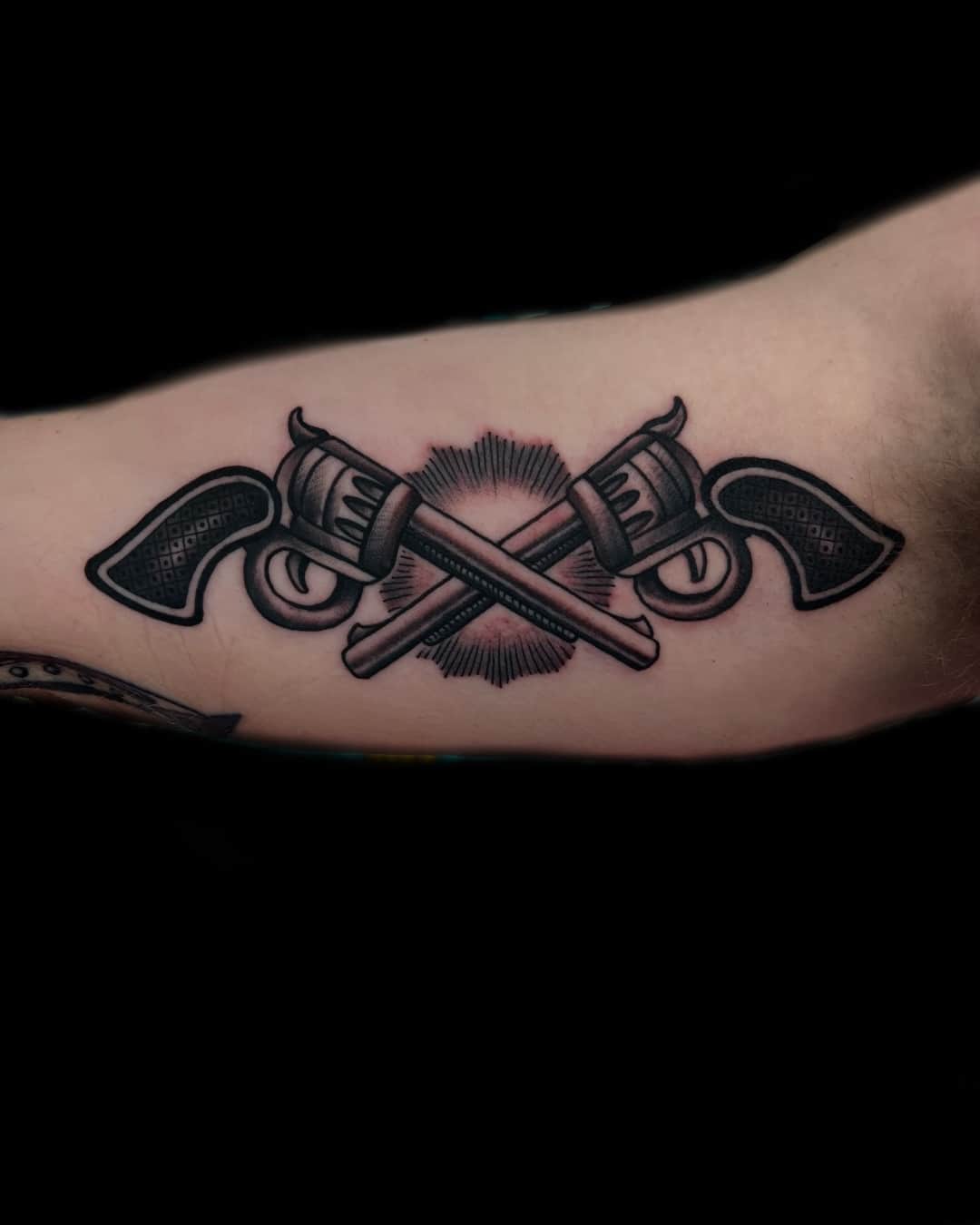 Small axe and ornamental filigree tattoo on the forearm, American Traditional style, by Donny Newman in Austin, TX