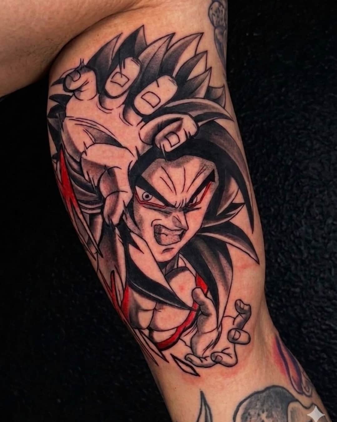 Anime character, dragon ball and goku tattoo on the upper arm, Anime & Pop Culture style, by Inksane Shorty in Austin, TX