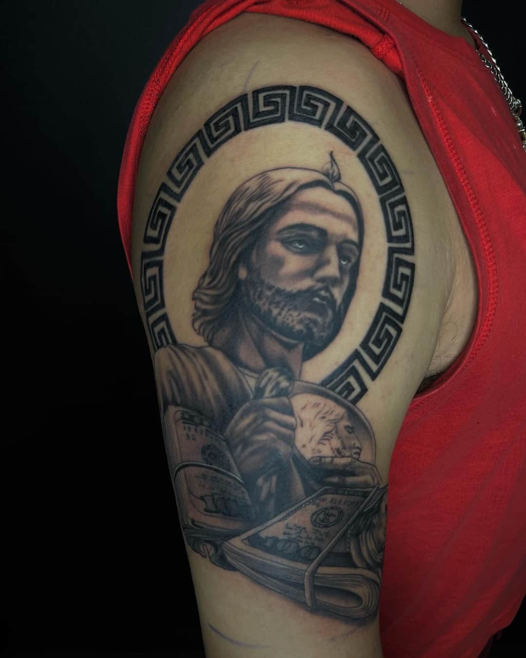 Money, greek key and madonna tattoo on the upper arm, half sleeve, Chicano style, by Inksane Shorty in Austin, TX