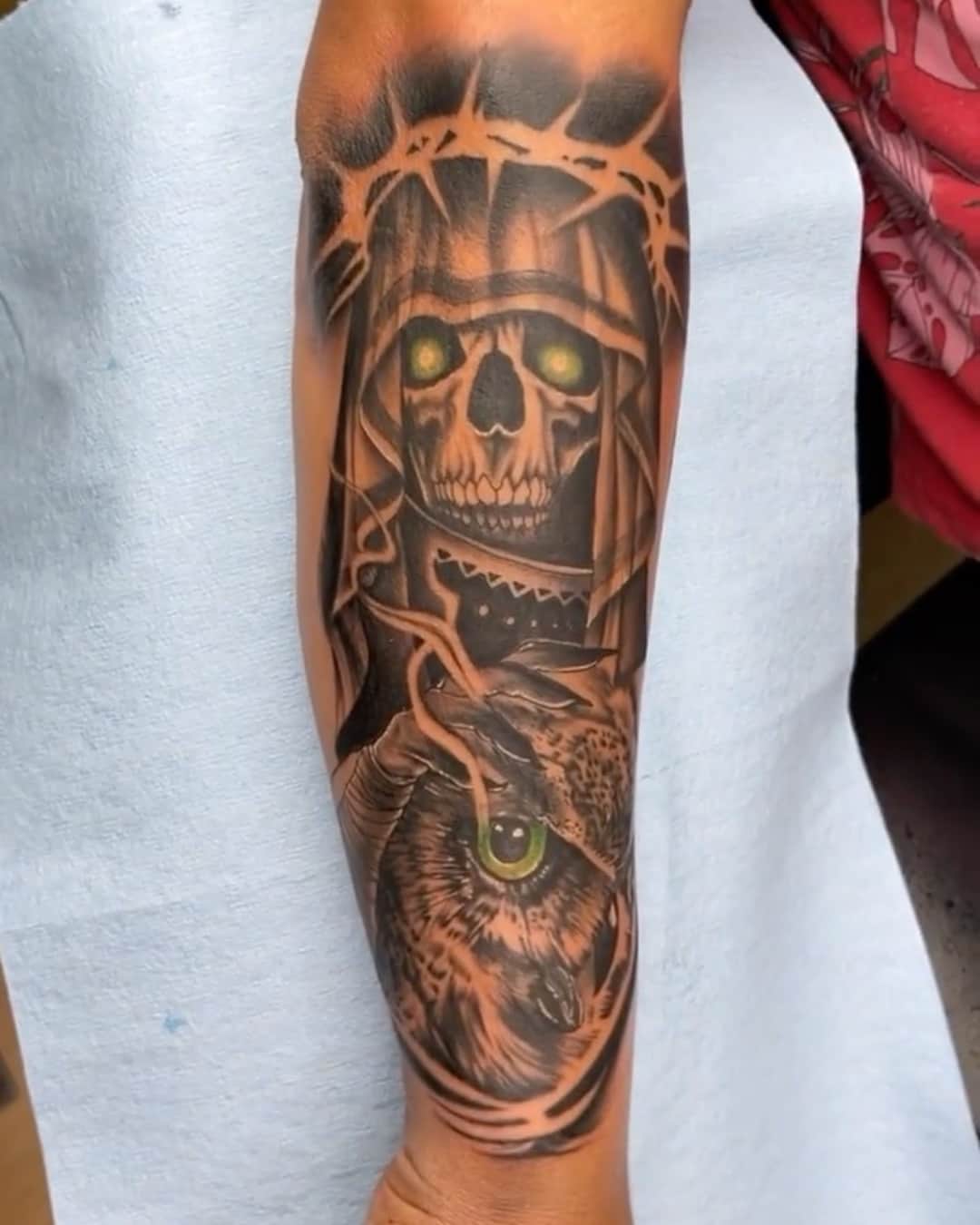 Skull, owl and reaper tattoo on the forearm, half sleeve, Chicano style, by Inksane Shorty in Austin, TX