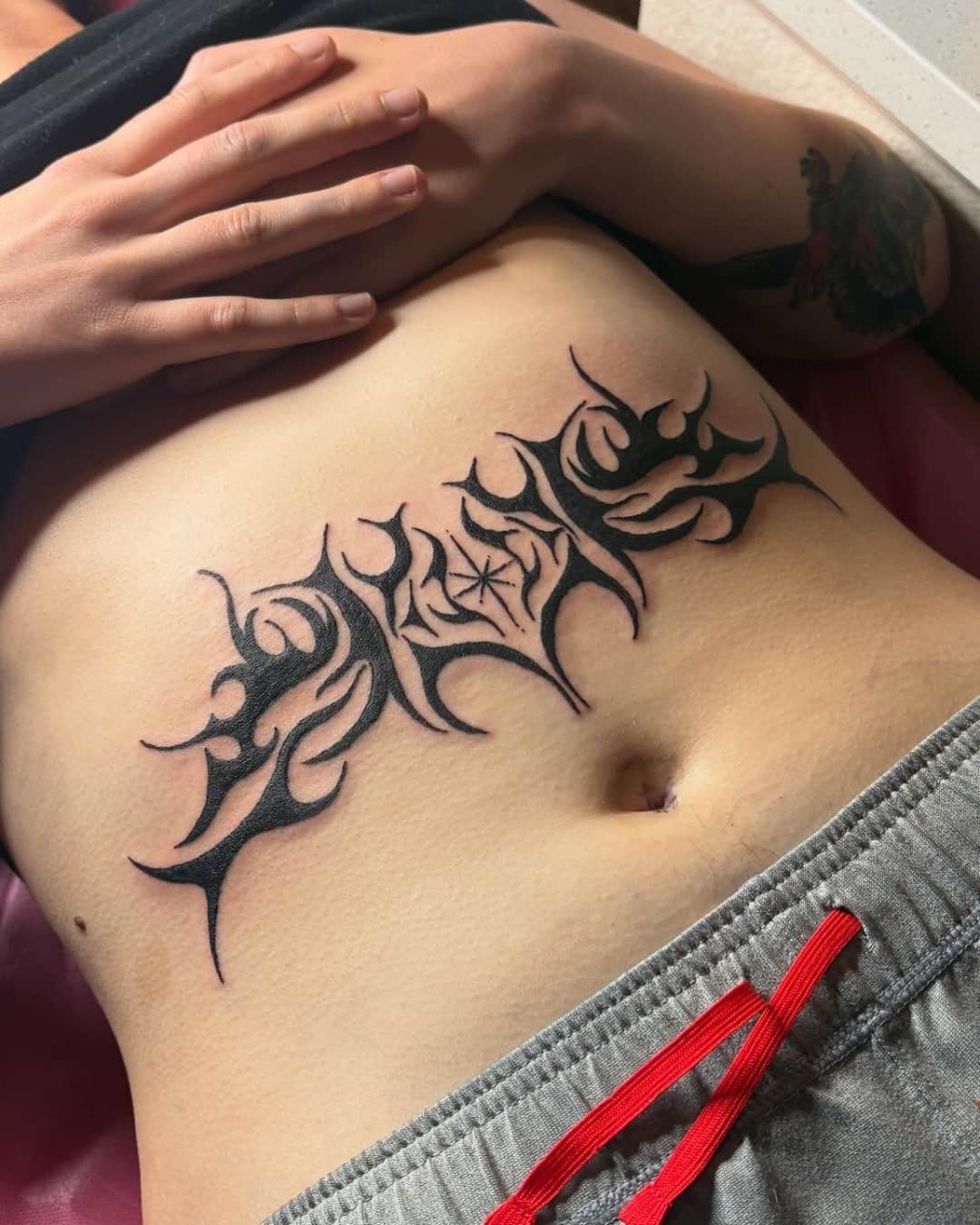 Tribal pattern tattoo on the stomach, Cyber-tribal style, by Emma in Austin, TX