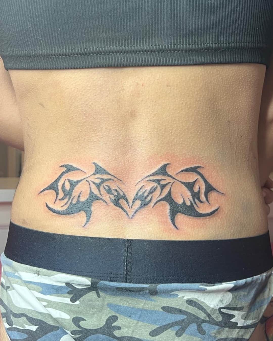 Tribal pattern tattoo on the lower back, Cyber-tribal style, by Emma in Austin, TX