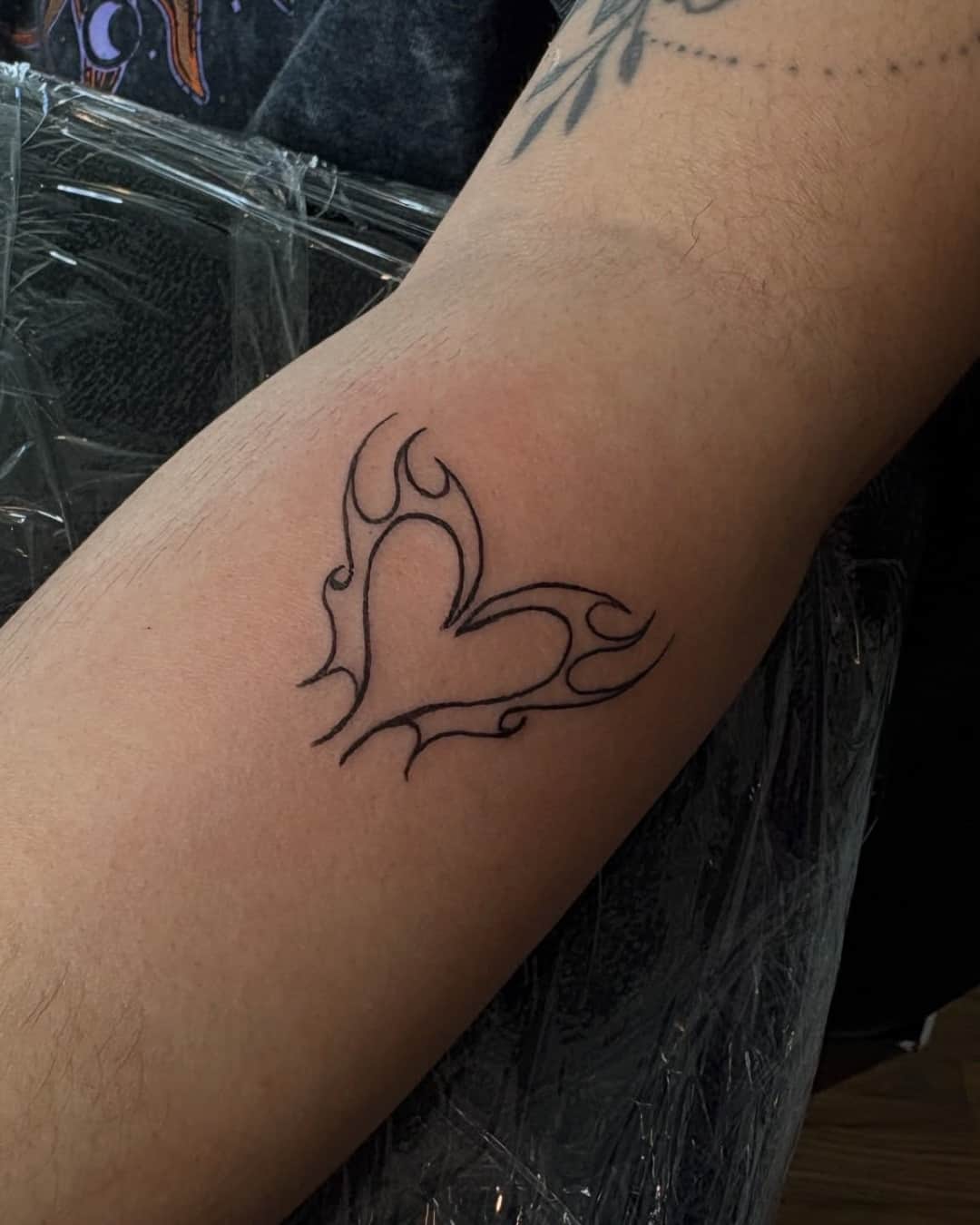 Small heart symbol and fire tattoo, Cyber-tribal style, by Emma in Austin, TX