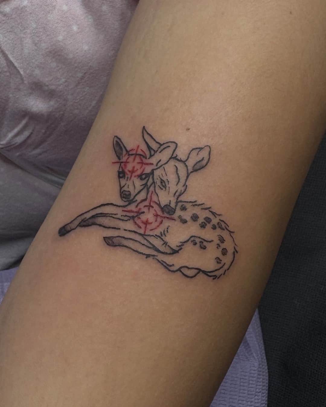 Small deer and crosshair tattoo, Fine Line style, by Emma in Austin, TX
