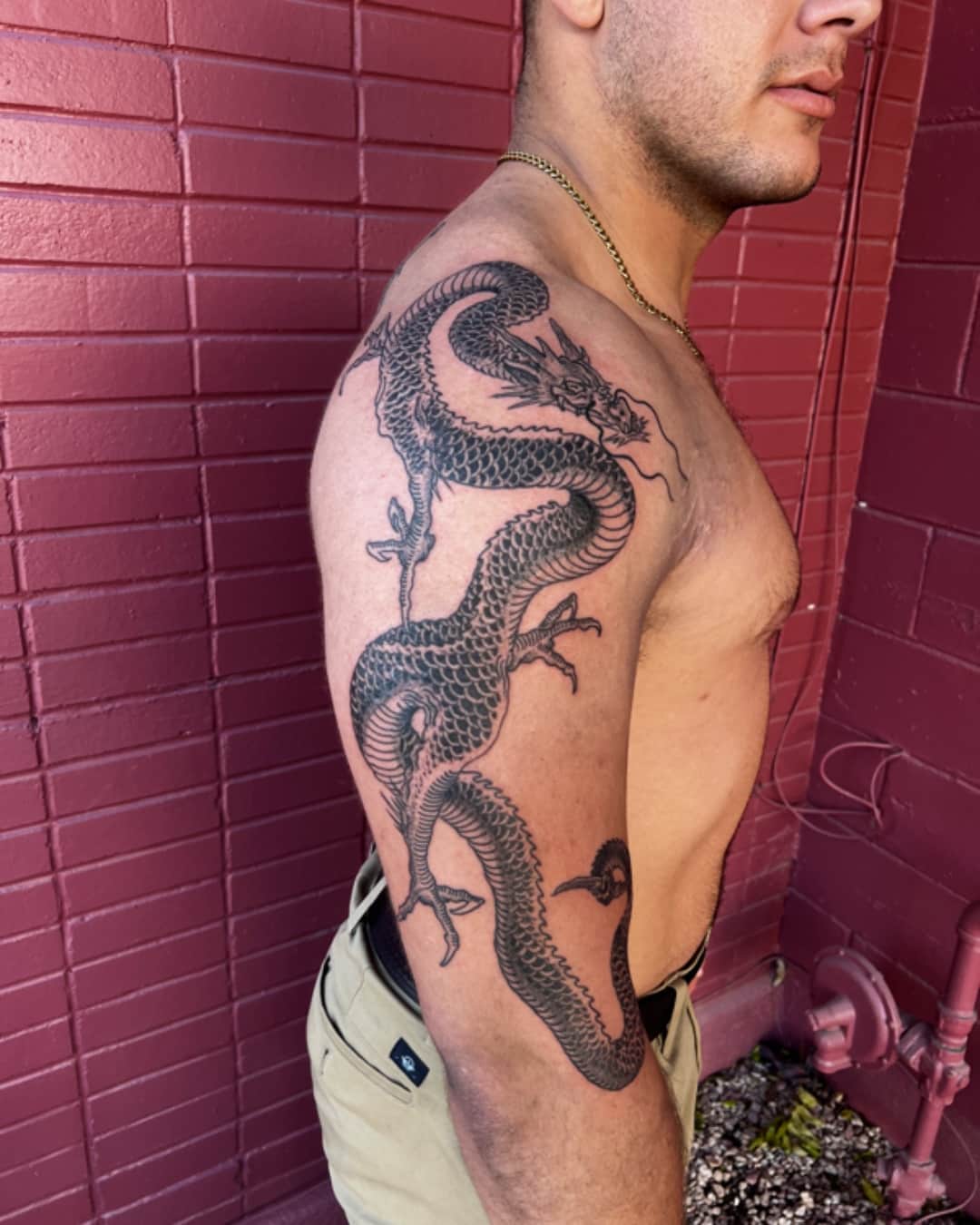 Dragon tattoo on the shoulder, large piece, Illustrative style, by Donny Newman in Austin, TX