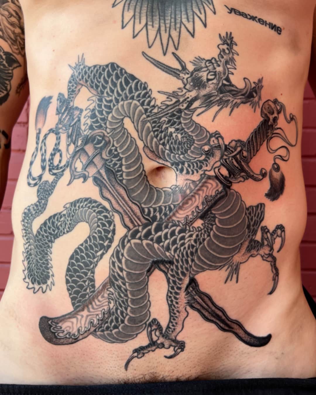 Dragon and feather tattoo on the chest, large piece, Illustrative style, by Donny Newman in Austin, TX
