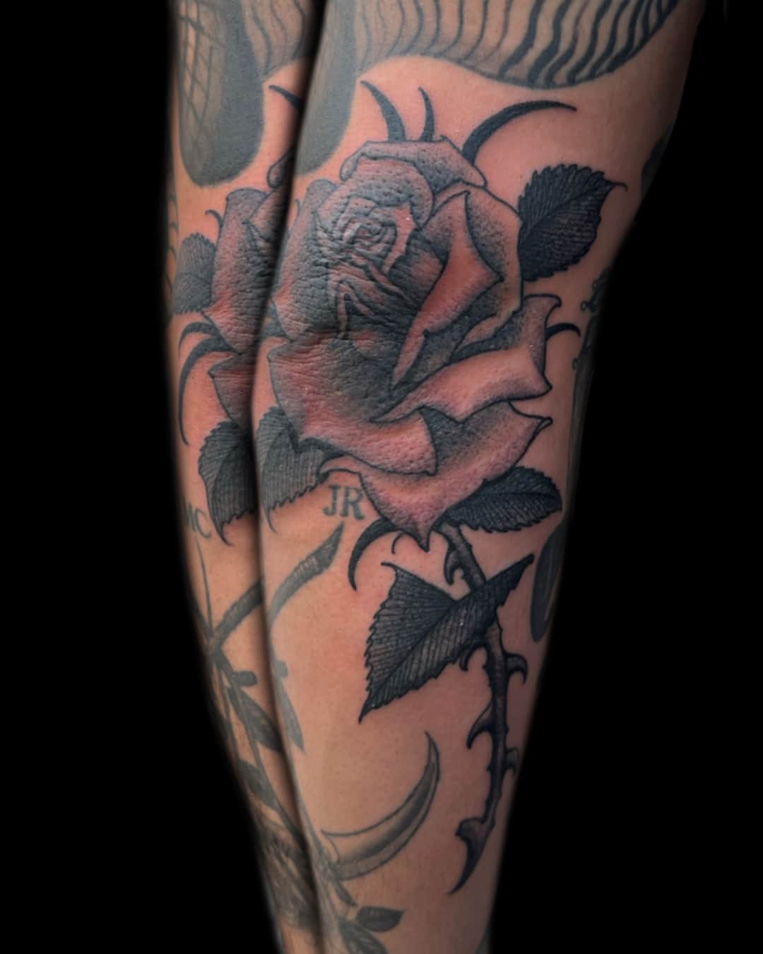 Rose and leaf tattoo on the thigh, large piece, Illustrative style, by Donny Newman in Austin, TX