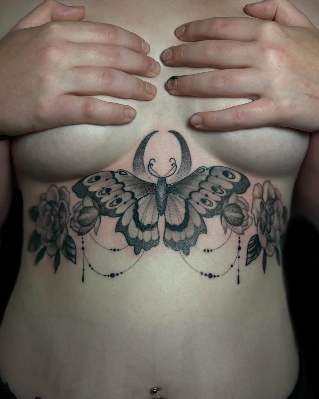 Butterfly, moth, ornamental filigree and moon tattoo on the chest, Illustrative style, by Donny Newman in Austin, TX