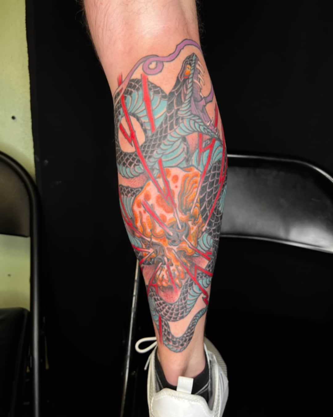 Snake, anatomical heart and fire tattoo on the calf, large piece, Illustrative style, by Donny Newman in Austin, TX