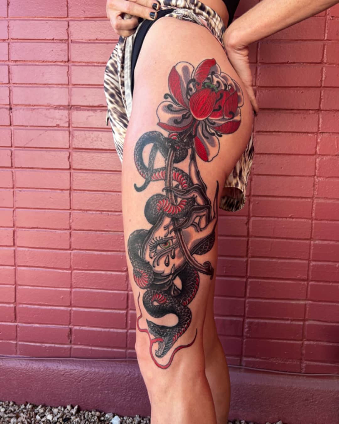 Snake and rose tattoo on the thigh, large piece, Illustrative style, by Donny Newman in Austin, TX