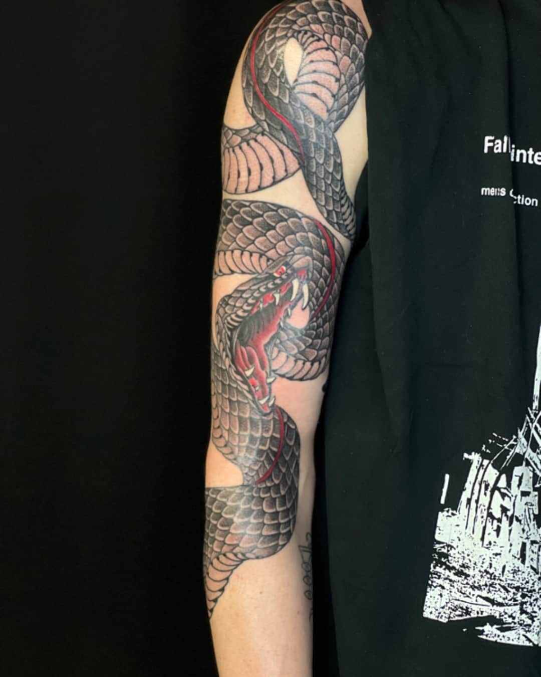 Snake tattoo on the upper arm, sleeve, Illustrative style, by Donny Newman in Austin, TX