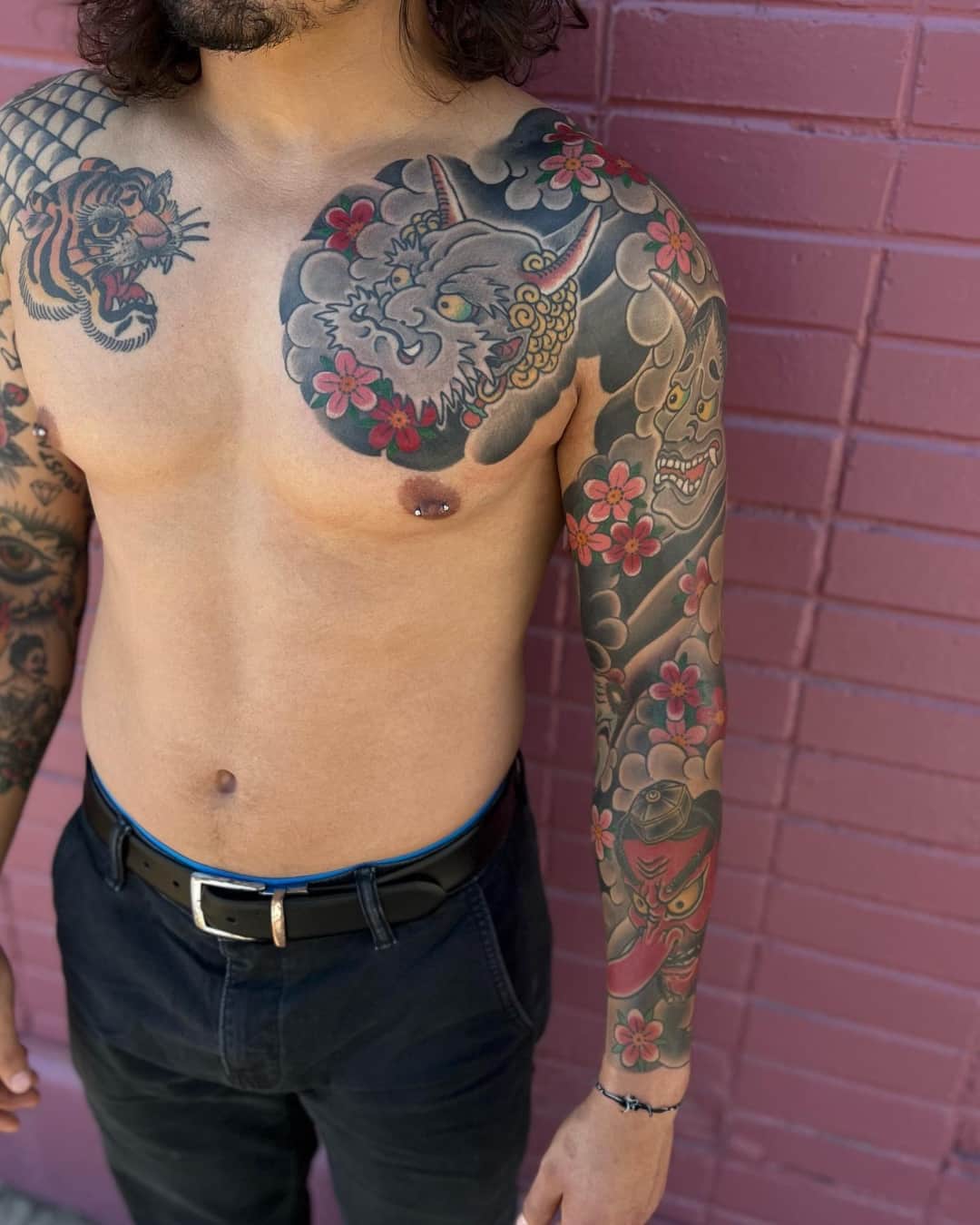 Hannya mask, flower and tiger tattoo on the upper arm, sleeve, Japanese style, by Donny Newman in Austin, TX