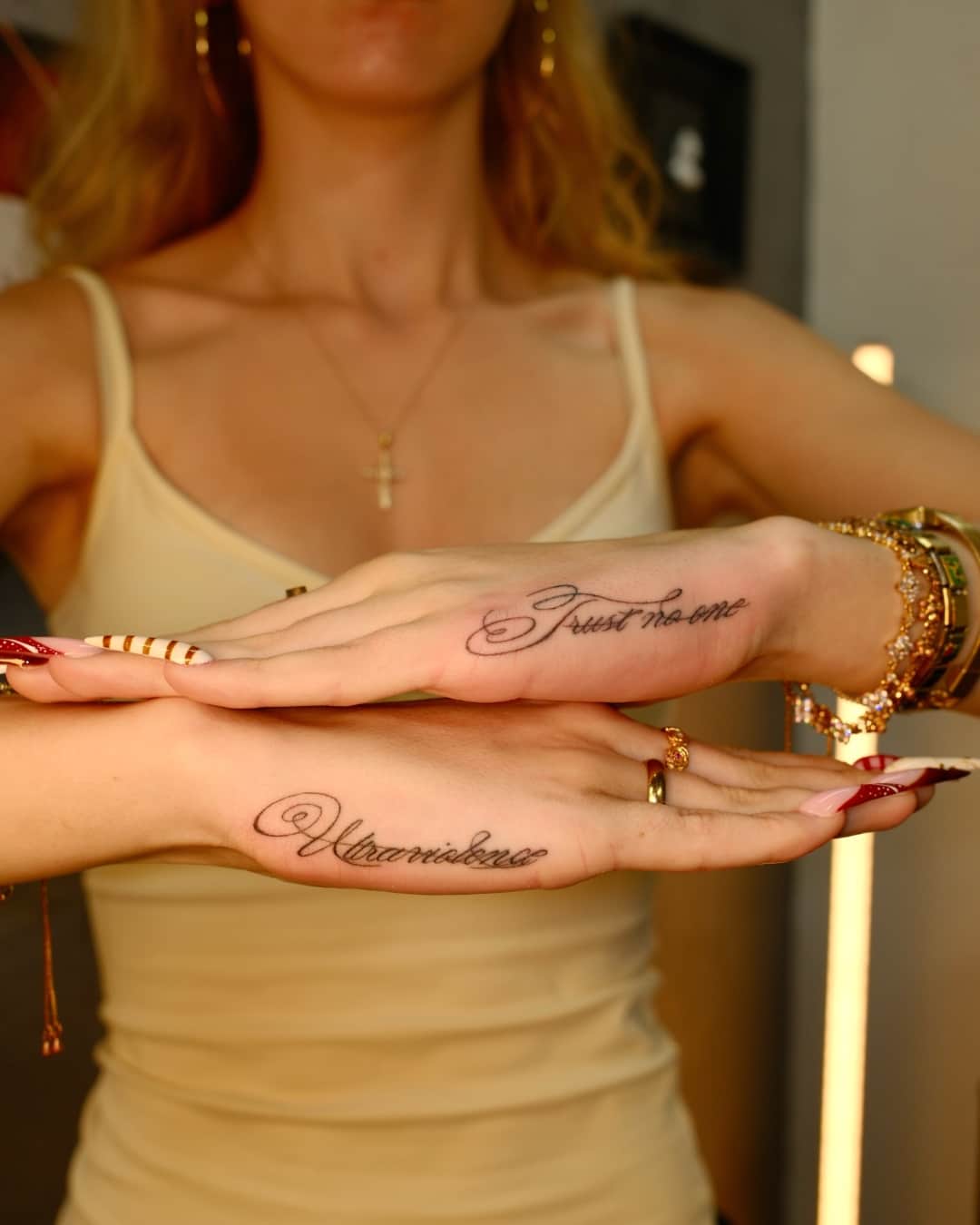 Small tattoo on the hand, Lettering style, by Luisa Duarte in Austin, TX