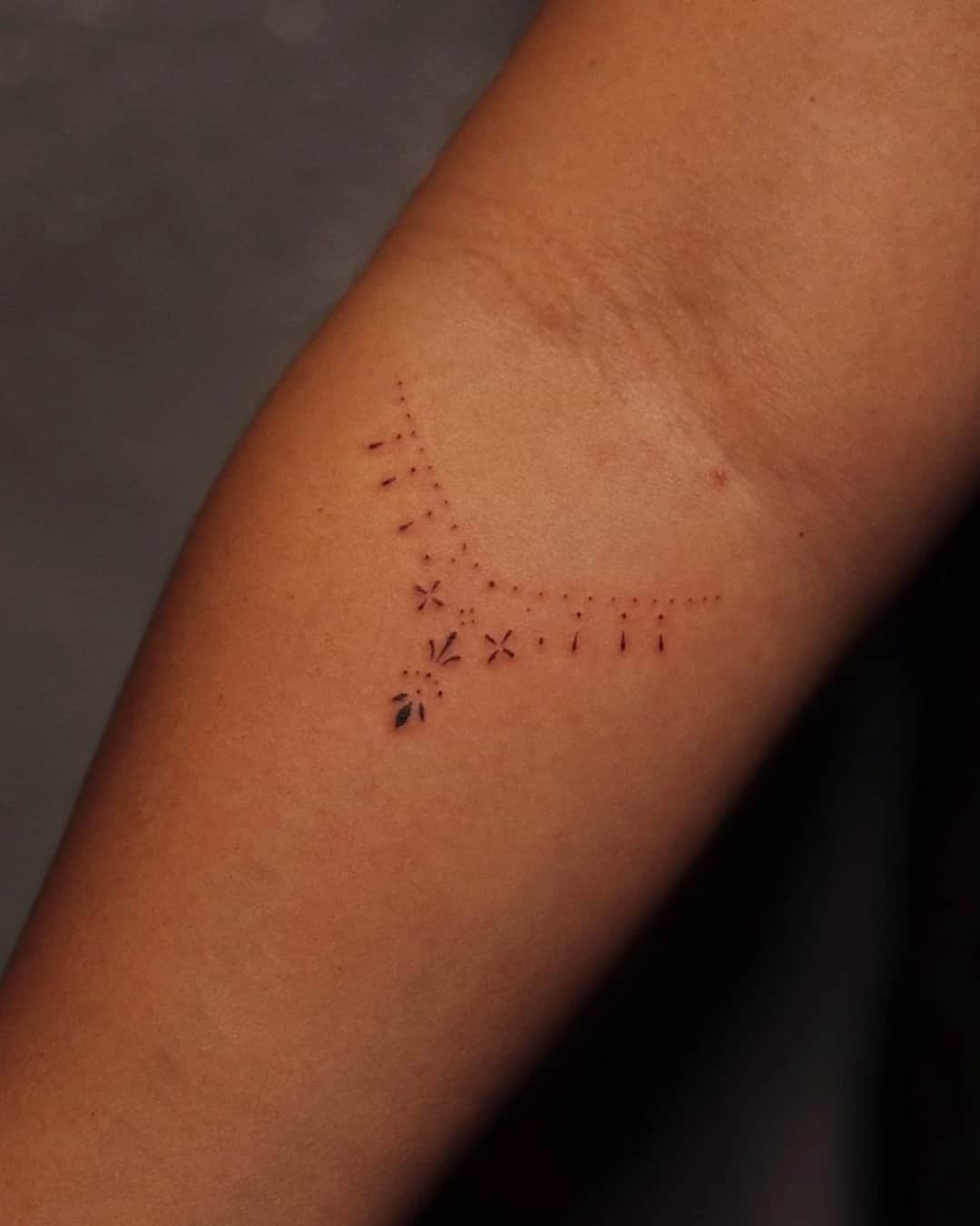 Small abstract tattoo on the forearm, Ornamental style, by Luisa Duarte in Austin, TX