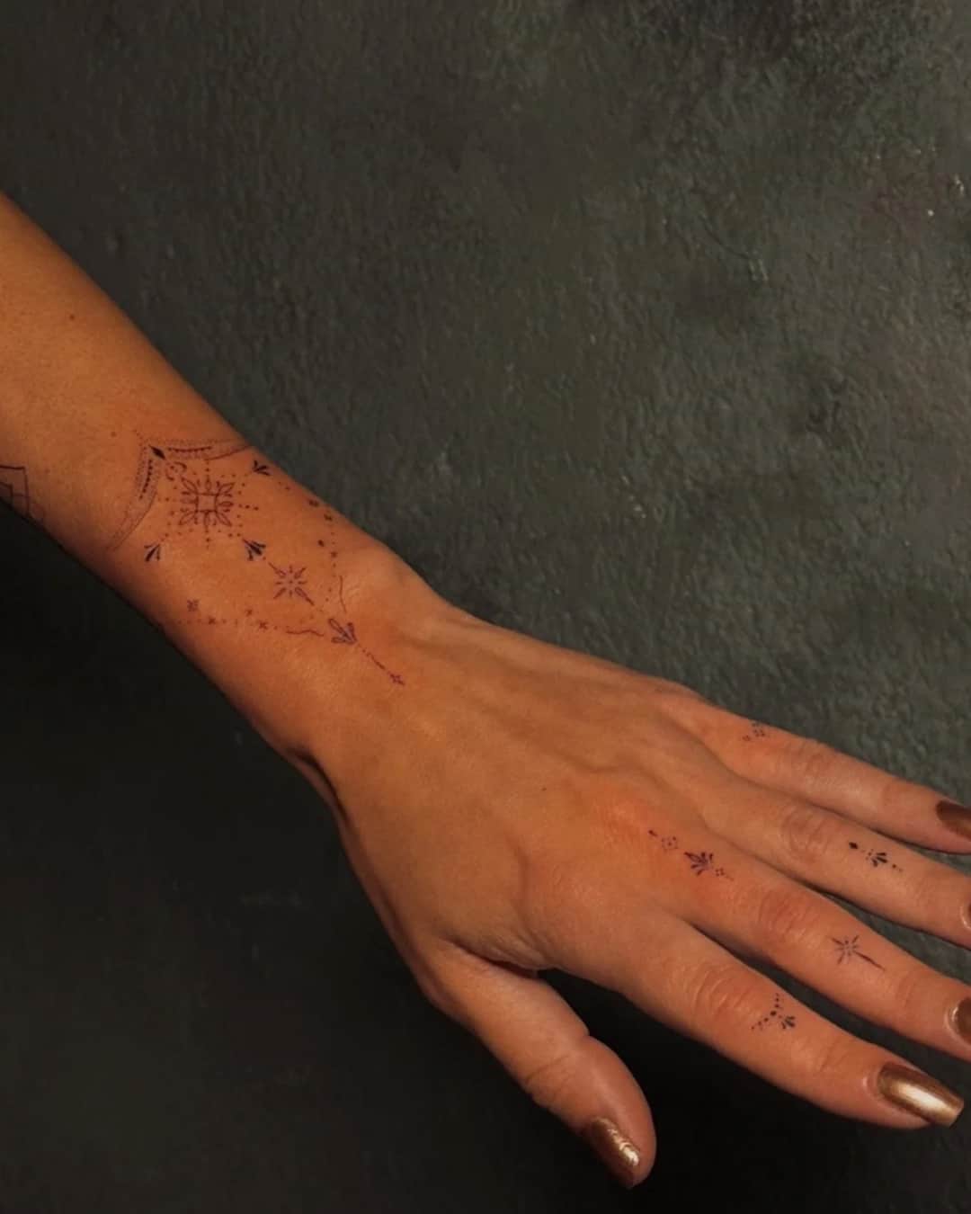 Star and flower tattoo on the forearm, patchwork, Ornamental style, by Luisa Duarte in Austin, TX