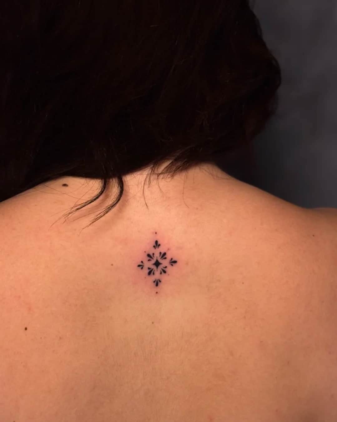 Small geometric pattern and mandala tattoo on the upper back, Ornamental style, by Luisa Duarte in Austin, TX