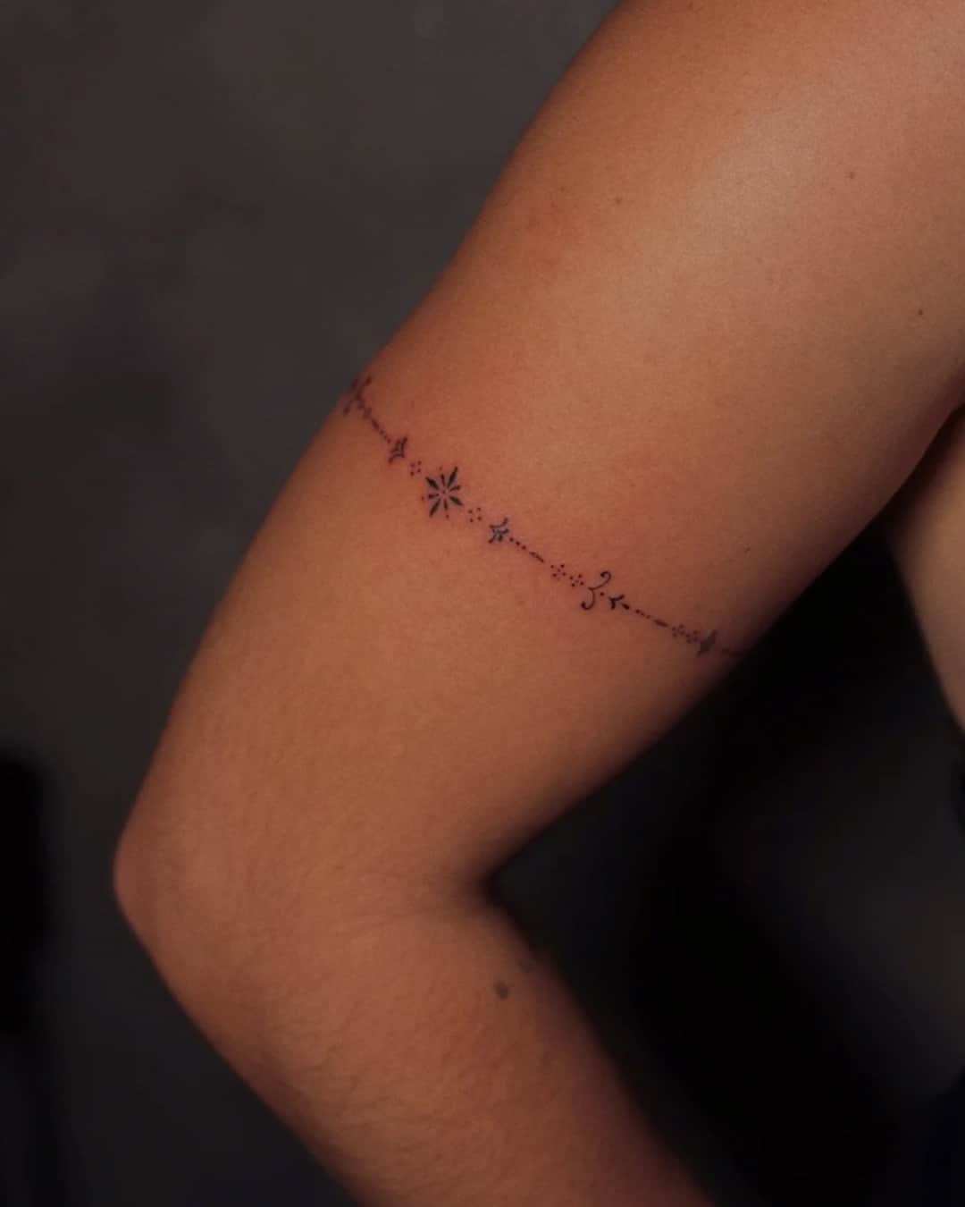 Small star, line work and constellation tattoo on the forearm, Ornamental style, by Luisa Duarte in Austin, TX