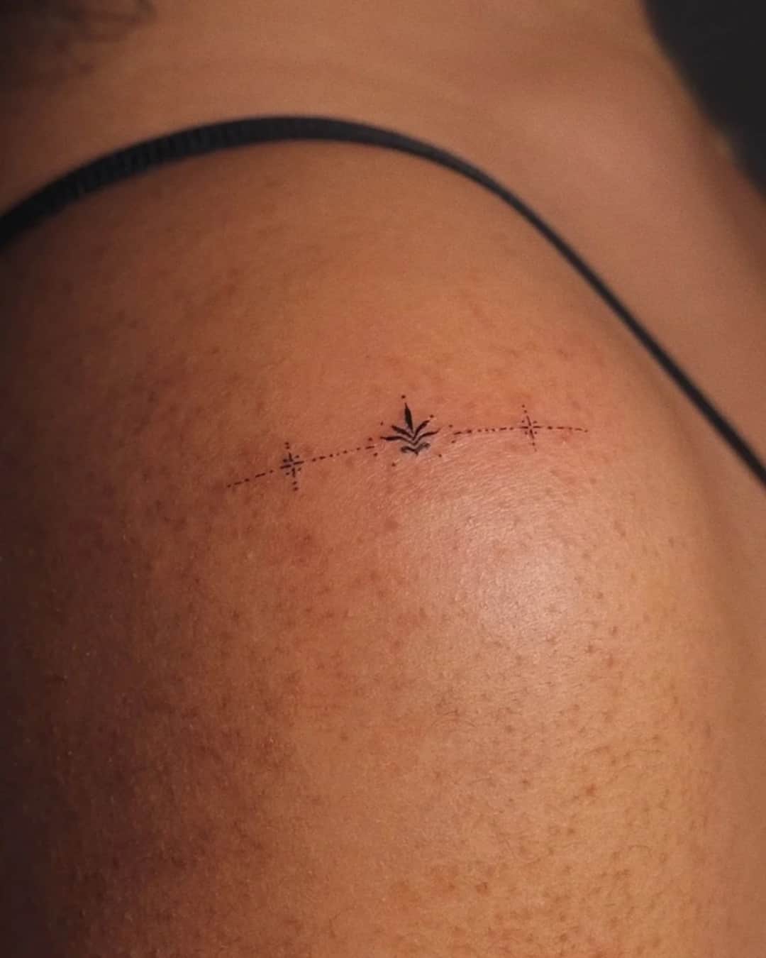 Small crown and star tattoo on the shoulder, Ornamental style, by Luisa Duarte in Austin, TX