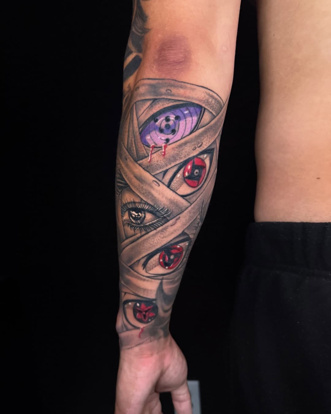 Naruto, eye and sharingan tattoo on the forearm, half sleeve, Anime & Pop Culture style, by Inksane Shorty in Austin, TX