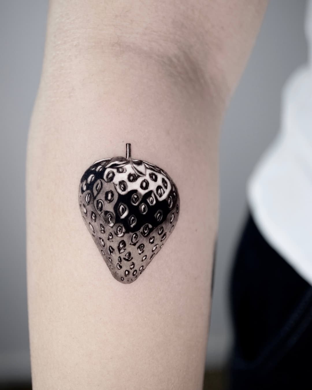 Small fruit tattoo on the forearm, Chrome style, by test in Lyon, France