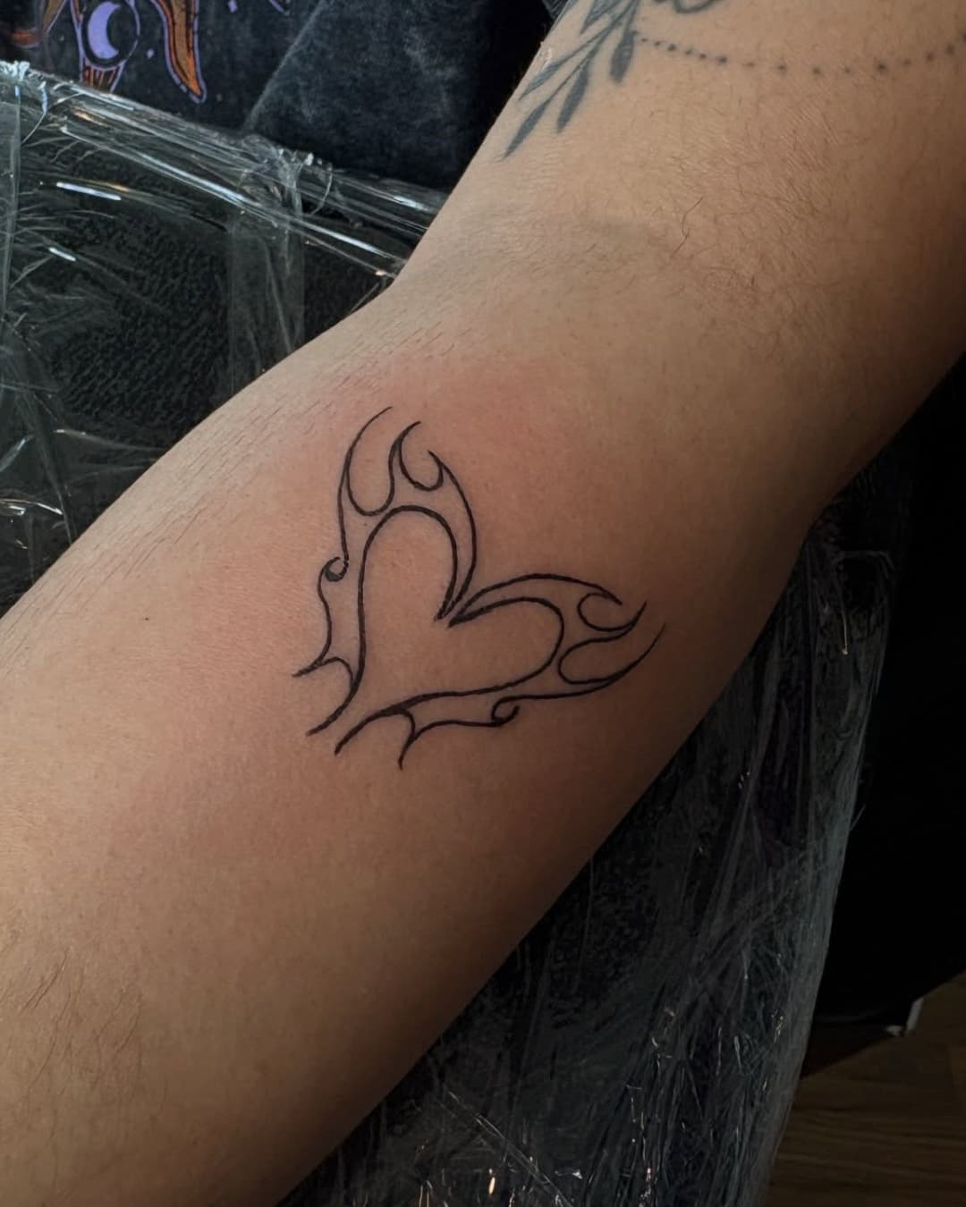 Small heart symbol and fire tattoo, Cyber-tribal style, by Emma in Austin, TX