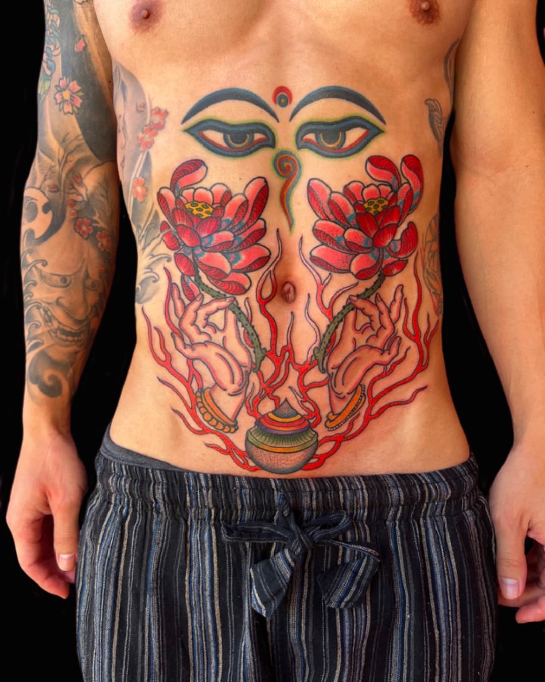Eye, lotus and fire tattoo on the chest, large piece, Illustrative style, by Donny Newman in Austin, TX